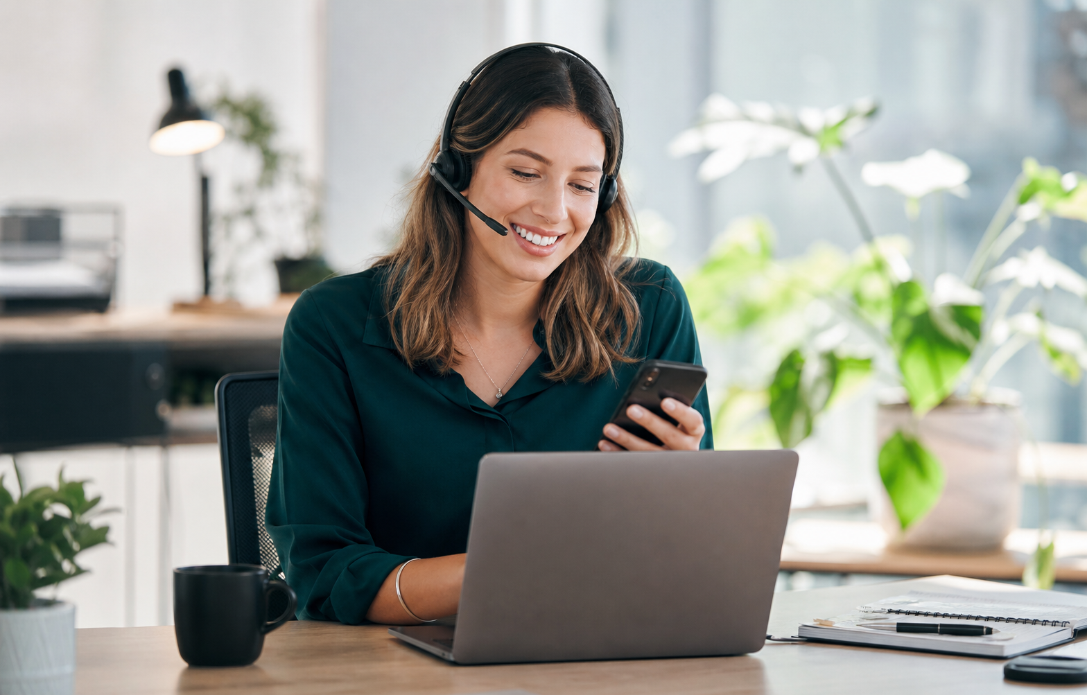 Smiling support specialist sending a customer SMS